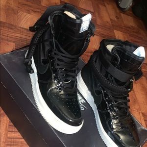 Women’s high top black Nike air force ones